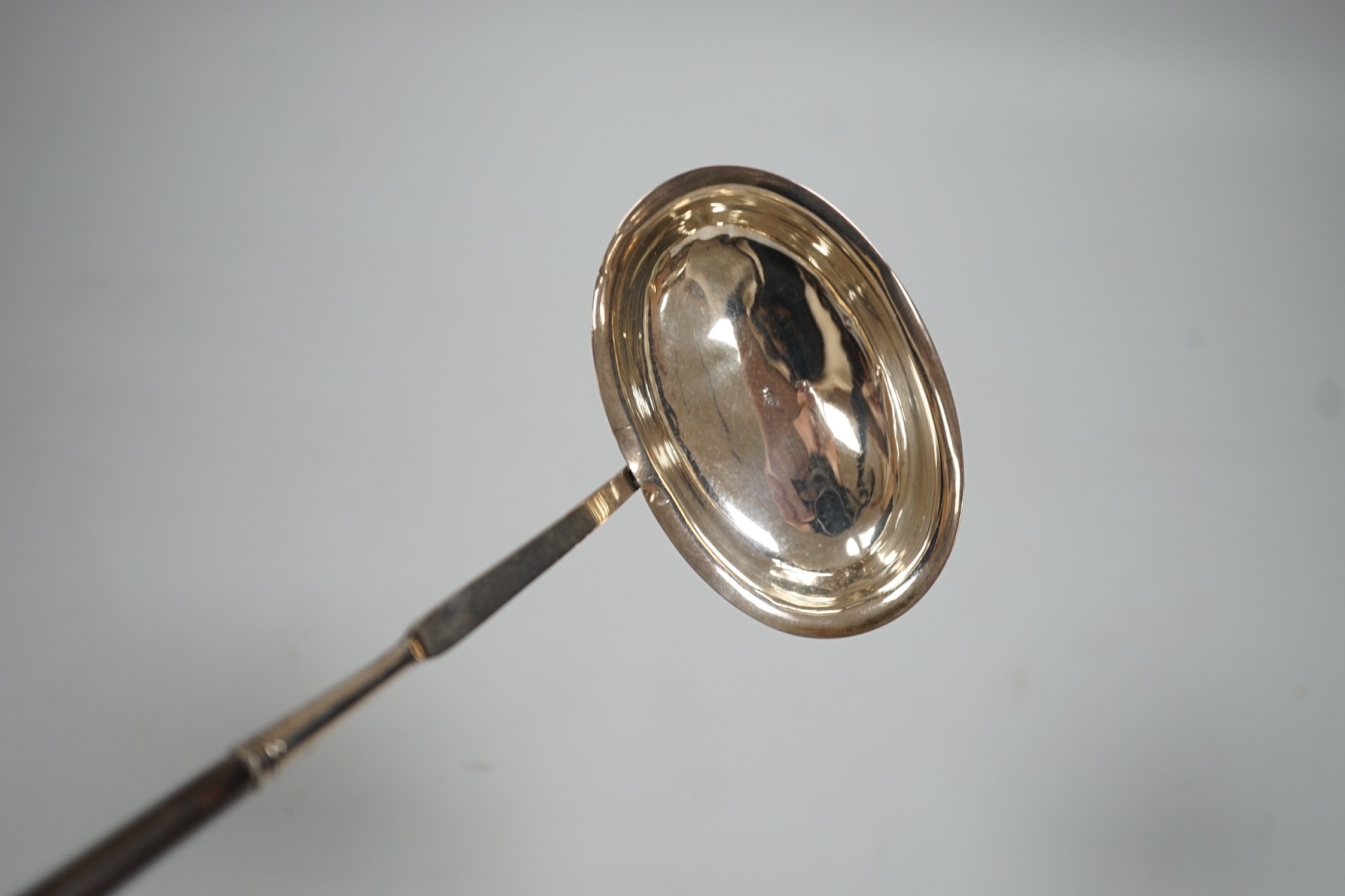 An early 19th century silver toddy ladle with demi barley twist baleen handle, maker IS?, maker's mark and duty mark only, 36.5cm.